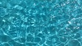 Rippled Water Surface In Swimming Pool. Blue Water Surface Background