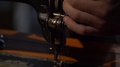 Footage Of A Tailor Aligning The Thread On His Sewing Machine