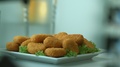 Delicious Breaded Chicken Or Turkey Nuggets Fall Into A White Flat Plate