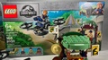 Camera Focusing On A Dilophosaurus Lego Toy And Then On A Lego Mini Figure