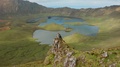 Woman On Rock And Breathtaking View Of Huge Caldeirao Volcano. Aerial Of Corvo