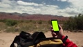 Male Hand Using Smartphone Green Screen At The Mountains.