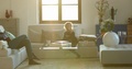 Candid Casual Family Living Room Atmosphere With Toddler Baby And Mom Sitting