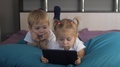 Happy Family A Concept Little Children Play Digital Tablet. Young Kids Watch
