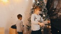 Two Happy Kids Playing, Whirl And Laugh At The Christmas Tree