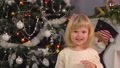 Cute Girl On The Background Of Christmas Tree