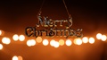 Merry Christmas Hanging Text Banner With Bokeh Background