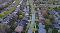 Descending Aerial Over Rows Of Middle Upper Class Homes Single Family Units