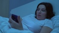 Tired Woman Browsing Internet On Smartphone In Bed At Night, Gadget Addiction