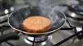 Beautiful Slow Motion Vegan Plant Based Burger Cooking On Frying Pan