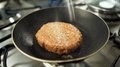 Tempering Vegan Plant Based Burger Cooking On Frying Pan