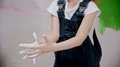 Little Girl Is Examining Her Hands In White Paint