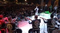 Wide Angle Shot From Behind Mariachi Band On Stage With Large Audience In