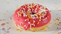Sprinkling Sugar Sprinkles On Rotating Red, Pink Donut, Doughnut, Slow Motion