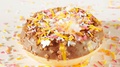 Sprinkling Colorful Sugar Sprinkles On Rotating Chocolate Donut, Doughnut