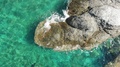 Calm Emerald Sea Over Rocks. Beach Mourtias, Greece
