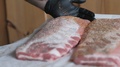 Applying Red Pepper Rub To Raw Pork Meat Preparing For Barbecue Smoking