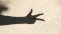 Shadow Of A Hand Showing Numbers With Fingers Countdown From Three To One