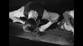 1940s - An Overhead Shot Shows Factory Workers Filing Metal Objects.