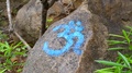Religious Om Hindu Symbol Sign Painted On Rock, India