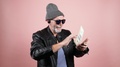Modern Aged Hipster Throwing Dollar Bills.