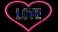 Colorful Love Font Word Inside Of A Red Heart Shape On Black Surface