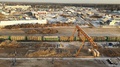A Large Sawmill Located In Village Aerial View. Modern Woodworking Factory With