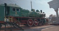 Old Green Color Steam Locomotive Train With A Red Wheels. Moving Clip.