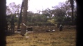 Kenya-1969: People Standing Underneath A Tattered Canopy And Sitting In A Field