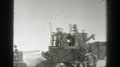 California-1939: Three People And Two Agricultural Machines Harvesting In The