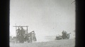 California-1939: View Of People Driving Harvester Machines On A Sunny Day