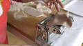 Female Using Manual Pasta Machine In Kitchen. Homemade Pasta. Close Up