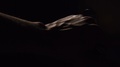 Close Up Of Male's Hand Closing Door Against Dark Background, Slow Motion