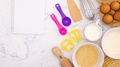Notebook For Recipe Appear On Marble Table With Cooking Supplies - Stop Motion