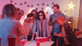Woman Playing Beer Pong And Drinking From Cup At House Party With Friends