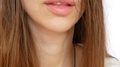 Juicy Lips Of A Young Beautiful Woman Drinking The Beer From A Glass Close Up