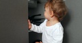 One Year Old Baby Boy Opening Kitchen Cabinet Cupboard Closer Door. Infant To