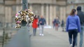 Clip Of Love Locks On A Pole In Paris City Centre With People Walking Out