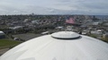 American Flag Waving In The Wind At The Top Of Iconic Tacoma Dome With