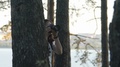 Photographer Behind A Tree. Female Photographer Amateur In The Forest Takes