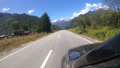 View From Drivers Window To A Straight Paved Road In Patagonia With Mountains