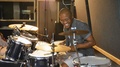 Portrait Happy Male Drummer Practicing In Recording Studio