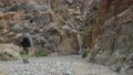 A Hiker Walks Through Fall Canyon - Death Valley National Park