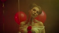 Bored Woman Clown Pennywise Cosplay Plays With Red Balloon, Creative Make-Up
