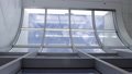 Time Lapse: Thin White Clouds Pass Airport Curved Metal Window, Static View