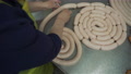 Workers In Meat Factory Forming Many Short Sausages From One Long Sausage. Sausa