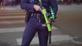 Armed Police Officer Patrolling The Street Of Los Angeles, During The