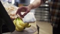 Theme Health And Natural Food. Close-Up Of The Hand Of A Man Putting On Bananas
