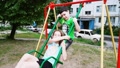 Slow Motion. Boy And Girl Ride On A Swing. Playgro