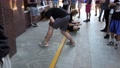 Young Guys - Students Draw, Graphics, Depict Letters On The Path With Crayons.